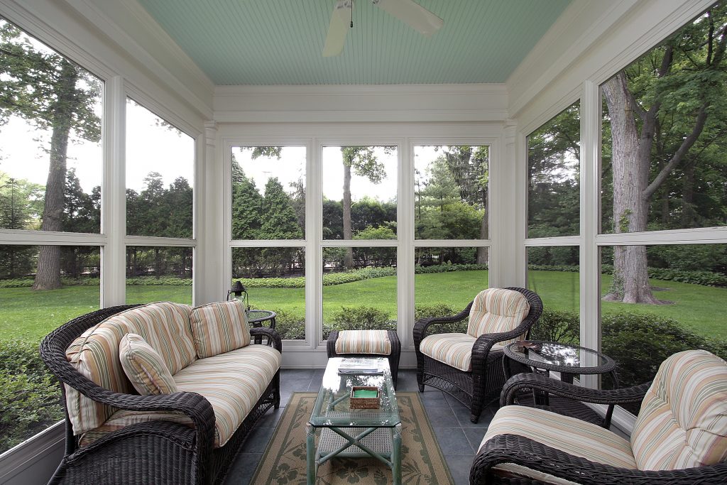 Porch in suburban home with wicker furniture